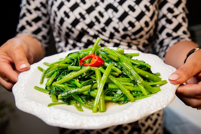 Fresh Stir-fried Water Spinach (Ong Choy / Kangkong) with garlic and chili, a vibrant vegetable side dish at Mo Jasmine Zurich.