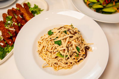 Stir-fried Shredded Tofu Skin (Gan Bian Dou Fu Si) with mushrooms and vegetables, a flavorful vegetarian option at Mo Jasmine Zurich.