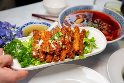 Crispy Fried Pork Ribs or Spareribs with a seasoned breading and green onions, a savory dish from Mo Jasmine Zurich.