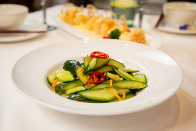 Refreshing smashed cucumber salad with chili and garlic, a classic Chinese side dish at Mo Jasmine Zurich.